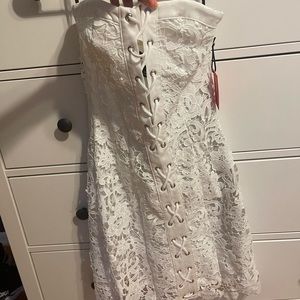 White lace tie up dress NEVER WORN from forever 21. Still has original tags on.